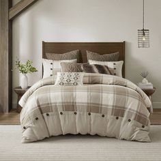 a bed in a room with a wooden headboard and foot board on the floor