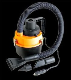 an orange and black vacuum is shown with its hoses attached to it's head