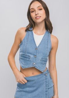 Sleeveless light wash denim vest top, featuring 3 buttons, 2 faux pockets Material: 72% Cotton 24% Polyester 3% Rayon 1% Spandex High Fashion Denim, Vest Denim, Denim Vests, Lucky Jeans, Vest Crop Top, Wardrobe Color, Playful Style, Cropped Vest, Colored Denim