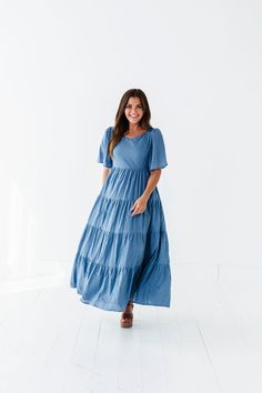 Features Sweetheart neck Flutter sleeves Tiered skirt with floral embroidered detail Smocked back Elastic waist Dusty blue color Pockets Self: 100% Cotton; Lining: 100% Polyester Size + Fit Small 0-4, Medium 4-8, Large 8-12, XL 14-18 Kristin is 5'4", a size 1 and is wearing a Small Runs true to size. Measurements taken while laying flat and then doubled. They do no account for stretch. Click here for shoes Size Bra Band Length Small 34" 49" Medium 36" 49" Large 38" 50" X-Large 40" 50" Dusty Blue Color, Curvy Swim, Curvy Dress, Resort Collection, Tier Skirt, Sweetheart Neck, Swim Bottoms, Tiered Skirt, Flutter Sleeves