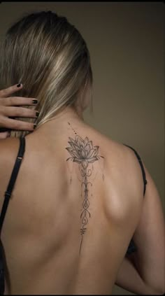 a woman with a tattoo on her back