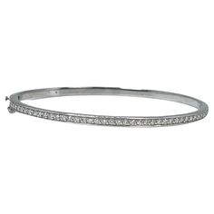 Diamond Bangle bracelet in 14KT white gold. GRAM WEIGHT: 9.42gr METAL: 14KT WHITE gold NATURAL DIAMOND(S) Cut: Round Color: G (average) Clarity: VS-SI (average) Carat: 0.45ct Length: 2.1 inches long by 1.9 inches wide Item number: 170-00008 FKE WHAT YOU GET AT STAMPAR JEWELERS: Stampar Jewelers, located in the heart of Jupiter, Florida, is a custom jewelry store and studio dedicated to providing 100% satisfaction to each client. Our personal attention to detail, passion, affordability and honest Diamond Bangle Bracelet, Jupiter Florida, Diamond Bangles Bracelet, Diamond Bangle, Bracelet Bangle, Jewelry Store, Bangle Bracelet, Custom Jewelry, Jewelry Stores