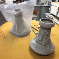 the vase is made out of clay and ready to be worked on in the shop