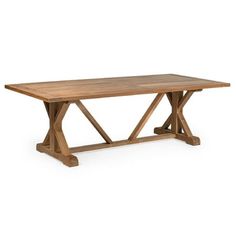 a wooden table sitting on top of a white floor