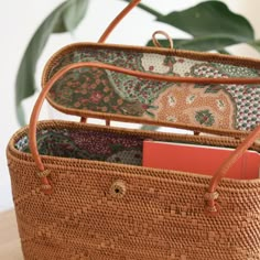 The Bali Rattan Tote Bag With Lid is the perfect accessory for any stylish woman. This beautiful, handmade rattan bag is made by skilled artisans in Bali, using natural materials to create a one-of-a-kind piece that is both fashionable and functional. The tote design and lid make it the perfect bag for everyday use, while the natural rattan adds a touch of elegance to any outfit. Whether you're headed to the office or the beach, the Bali Rattan Tote Bag With Lid is the perfect addition to your w Rattan Handbags, Tote Design, Accessory Inspo, Rattan Bag, Handcrafted Bags, Perfect Bag, Cotton Bag, Mens Socks, Cloth Bags