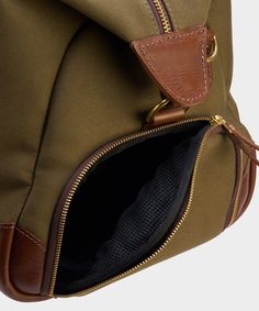 Green Duffle Bag For On-the-go, Travel Duffle Bag In Khaki Canvas, Khaki Canvas Duffle Bag For Travel, Khaki Canvas Travel Bag, Luxury Green Travel Bag For Everyday Use, Khaki Travel Bag With Zipper Closure, Khaki Travel Backpack With Zipper Pocket, Khaki Backpack With Zipper Pocket For Travel, Travel Shoulder Bag With Zipper Pocket In Khaki