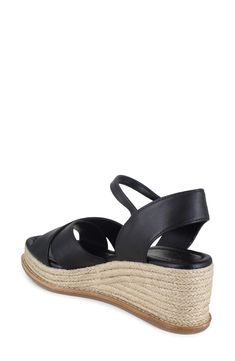 Wide straps crisscross over the vamp of an espadrille-inspired sandal lofted by a jute-wrapped platform and integrated wedge heel. 2" heel Adjustable ankle strap with buckle closure Cushioned footbed Leather upper/synthetic lining and sole Imported Open Toe Espadrille Wedge Sandals With Wrapped Heel, Espadrille Wedge Sandals With Wrapped Heel And Open Toe, Open Toe Espadrille Wedge Sandals, Open Toe Straw Wedge Sandals With Heel Strap, Wedge Sandals With Wrapped Heel For Vacation, Cross Strap Wedge Sandals For Beach In Summer, Cross Strap Wedge Sandals For Summer Beach, Vacation Cross Strap Wedge Sandals, Black Closed Toe Straw Sandals