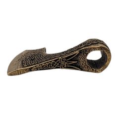 a metal object that looks like a snake's head with an intricate design on it