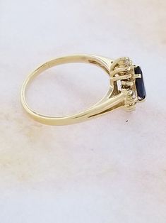 Buy 14k Yellow Gold Sapphire and Diamond Ring Online in India - Etsy Timeless Gold Cluster Ring With Gemstone, Yellow Gold Cluster Rings Hallmarked, Cluster Yellow Gold Hallmarked Rings, Yellow Gold Cluster Ring In Fine Jewelry Style, 14k Gold Halo Ring With Prong Setting, Yellow Gold Cluster Ring With Hallmark, 14k Stamped Cluster Jewelry For Anniversary, 14k Gold Cluster Diamond Ring Fine Jewelry, Heirloom Yellow Gold Sapphire Ring With Halo Setting