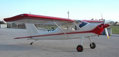 a small airplane sitting on top of an airport tarmac