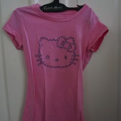 Pink Hello Kitty Tee With Gem Detail Size S. 100% Cotton. Armpit Tp Armpit 11 3/4 Inches. Top To Bottom 18 5/8 Inches. P-B4 Y2k Hello Kitty Clothes, Hello Kitty Crew Neck Top, Fitted Hello Kitty Crew Neck Top, Fitted Cotton Hello Kitty Top, Hello Kitty Baby Tee, Fitted Cotton T-shirt With Hello Kitty, Pink Hello Kitty Cotton Top, Cute Pink Hello Kitty T-shirt, Fitted Short Sleeve T-shirt With Hello Kitty Print