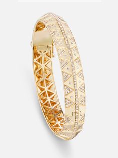 18k yellow gold knife edge bangle with diamond details. A regal combination of inlay stone, sparkling gems and substantial gold, the Chubby Stone Inlay bangle has all the elements of a masterpiece. Triangles of iridescent mother of pearl are set alongside a rainbow of round gemstones and a row of white diamonds. A single hinge and additional safety clasp make this bangle both bold and comfortable. Made to order. The current lead time is 8-10 weeks. Luxury Cuff Bracelet Bangle With Diamond Accents, Luxury Gold Bangle With Single Cut Diamonds, Gold Luxury Cuff Bracelet With Brilliant Cut, Luxury Diamond Cut Bangle, Luxury Gold Bangle With Brilliant Cut, Luxury Diamond Bangle, Luxury Gold Cuff Bracelet With Pave Setting, Luxury Yellow Gold Bangle With Diamonds, Designer Diamond Bangle