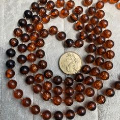 a coin is sitting on top of some beads