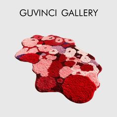 a red rug with flowers on it and the words guvini gallery above it