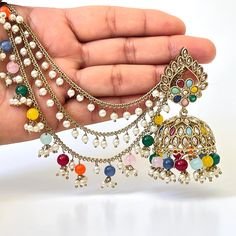 Restocked Bahubali Polki Pearl Jhumka/stone Jhumka/Indian Jewelry/Pakistani/Punjabi/Indian/Statement earring/Bridal earring/Indian wedding Can be paired with any dress Closure: Pushback This is 100% Handmade jewelry. So Color, shades, texture displayed may slightly vary from the actual product due to digital image limitations. We request you to consider these minor variations. Please expect the possibility of some slight imperfections when buying hand made jewelry. If you have any questions, please message or email us. Arrives in gift box. Please let me know if you have any questions. Thank you so much visiting my shop. Multicolor Heavy Chandbali Bridal Earrings, Multicolor Chandbali Bollywood Bridal Earrings, Multicolor Bollywood Chandbali Bridal Earrings, Multicolor Bollywood Bridal Earrings With Tilla, Bollywood Chandbali Bridal Earrings, Bollywood Multicolor Chandbali Bridal Earrings, Heavy Multicolor Chandbali Danglers, Multicolor Bridal Earrings With Latkans In Temple Jewelry Style, Multicolor Temple Jewelry Bridal Earrings With Latkans