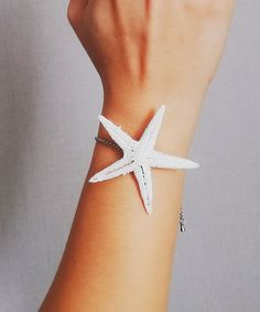 A dainty bridal starfish bracelet. Perfect for summer nautical style. Features the minimalist style with white natural real starfish. ❤S H I P P I N G ❥Shipping to the USA Standart shipping 7-12 business days Express shipping 3-4 business days ❥Shipping internationally Standart shipping 20-30 business days Express shipping 3-4 business days ❤A T T E N T I O N *INTERNATIONAL orders: PLEASE NOTE CUSTOMERS ARE RESPONSIBLE FOR ALL DUTIES & TAXES* Elegant Starfish Bracelets For Beach, White Star-shaped Jewelry With Starfish Charm, White Starfish Charm Bracelet, White Star-shaped Ocean-inspired Jewelry, Ocean-inspired White Star-shaped Jewelry, Ocean-inspired White Star Jewelry, White Starfish Bracelets For Summer, White Starfish Jewelry For Summer, Handmade White Starfish Bracelets