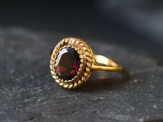 Gold Garnet Ring set with Natural Garnet in a perfect diamond cut, flawless clarity & deep red color, from Madagascar, at 10x8mm, 3 Carats. Gold Victorian Ring design made of Gold Vermeil ☞ thickest 18k Gold Plating on top of Solid 925 Sterling Silver ☞ made to last. Matching Pendant: www.etsy.com/uk/listing/927636832 Matching Earrings - please ask me ☞ Choose your size ☞ I resize (before shipping) for FREE to Any size* January Birthstone - Genuine & Natural Stones ❀ ⌛Last Ring left ⌛ Details : Gold Antique Ring, Vintage Garnet Ring, Garnet Ring Gold, Gold Garnet Ring, Garnet Ring Vintage, January Birthstone Rings, Natural Emerald Rings, Gold Flower Ring, Red Stone Ring