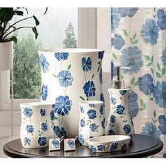 blue and white bathroom accessories sitting on top of a table