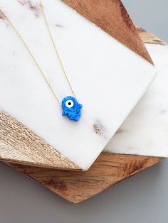 "14k Solid Gold Opal Blue Hamsa Hand Necklace - 14k Gold Evil Eye Necklace - 14k Opal Blue Evil Eye Pendant Necklace - Fine Jewelry for Women The Solid Gold Opal Hamsa Hand Evil Eye Necklace \"Protection\" for Women is composed of high-quality 14 Karat Gold. The Hamsa Hand figure is the most preferred amulet for eliminating bad energy. Destroying the effects of bad looks, it offers a simple yet beautiful detail on your neck. 🔳WARRANTY🔳 *6 Months warranty. *Free Shipping without price limit. *E Opal Hamsa Necklace, Blue Hamsa, Gold Evil Eye Necklace, Hamsa Hand Necklace, Hand Evil Eye, Bad Energy, Evil Eye Necklace Gold, Protection Jewelry, Gold Hamsa