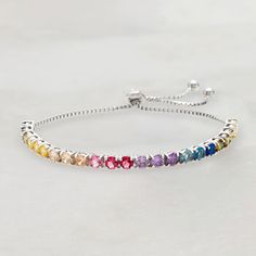 Ross-Simons - 5.52 ct. t. w. Multicolored Cubic Zirconia Bolo Bracelet in Sterling Silver. Dazzle your wrist in a sparkling spectrum of colors! Our rainbow bolo bracelet showcases yellow, green, champagne, pink, purple, and blue CZs, totaling 5.52 carats. Set in polished sterling silver. Sliding box chain adjuster allows the bracelet to fit most wrists. 3/16" wide. Multicolored CZ bolo bracelet. CZ weights are diamond equivalents. Green Champagne, Champagne Pink, Bolo Bracelet, Spinel Ring, Floral Bracelet, Bar Stud Earrings, Bar Studs, Circle Earrings Studs, Circle Studs