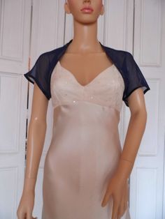 This is a beautiful hand made navy blue shrug ideal for weddings or special occasions. It can also be worn with casual wear. It can be made in any size from 8 to 24 (UK sizes). It is made in the UK. It is normally sent out to you within 5 days, but I am very happy to make your order a priority if you need it urgently. Just let me know the date needed by. Postage is free in the UK! International postage is £9. I am happy to exchange items or refund your payment if you are less than happy with the Elegant Stretch Open Front Shrug, Elegant Fitted Shrug With Open Front, Elegant Fitted Open Front Shrug, Fitted Open Front Shrug For Party, Blue Shrug, Shrug Jacket, Bolero Shrug, Beautiful Hand, Bridal Gowns