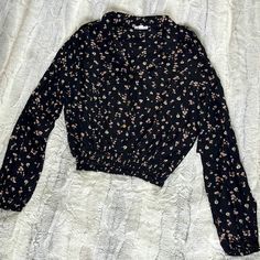 Women’s Button Up Crop Shirt -Black With Pink And White Flowers Size Large Two Faux Breast Pockets Shoulder Buttons Wide Elastic Waist New With Tags Black Collared Tops With Button Closure, Black Collared Top With Floral Print, Black Collared Floral Print Top, Black Floral Print Collared Top, Black Button-up Casual Top, Black Casual Tops With Button Closure, Casual Black Tops With Button Closure, Casual Black Blouse For Spring, Black Collared Top For Spring