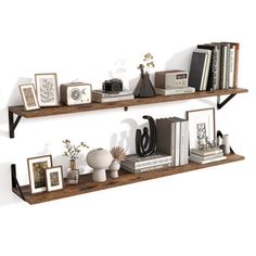 two wooden shelves with books and pictures on them, one shelf is holding various items