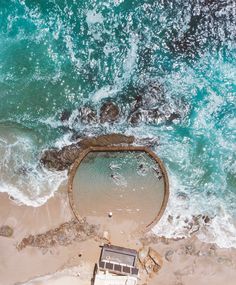 an aerial view of the ocean and beach