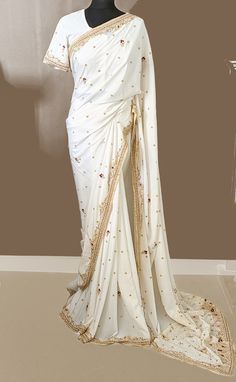 🎗Product Description 🎗 Presenting this beautiful ivory white handwork diamond, sequin, Zardozi, cut dana work crepe silk saree. Suitable for party wear, Wedding wear designer soft saree on premium fabric with all over work. Saree fabric  :-Crepe Silk Work     :-Hand Work with diamond, Zardozi, Embroidery thread work, Motifs  all over the saree. Colour  : Ivory White  Saree Length :- 5.50mtr Weight: 850 grams Blouse  Handwork on sleeves, Back side Plain Ready Made Stitched blouse with inner lining UK Size Suitable for 34-36 inches   Please Note: Slight variation in colour is possible due to digital photography Product Care: - Dry Clean Note:- Saree Fall and Saree Underskirt does not included. Occasion:- Festival, Party, Traditional, Brides maids, wedding, Marriage, any other occasions. Saree Outfits, Handwork Saree, Blouse Handwork, Soft Saree, Partywear Sarees, Off White Saree, Zardozi Work, Crepe Silk Sarees, Zardozi Embroidery