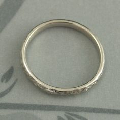 White Gold Skinny Flourish Band Women's Wedding Band Women's White Gold Band Vintage Style Band Antique Style Ring White Gold Wedding Band This is a slimmer version of our Flourish Le Femme band: https://www.etsy.com/listing/151251996 And our Flourish Wide: https://www.etsy.com/listing/179128813 At a dainty 2.4mm wide by 1.5mm thick, this is the perfect thinner wedding band or stacking ring. You simply can't do without it! Pair it with your other stacking rings or wear it alone as a symbol of yo Heirloom Wedding Ring With Decorative Band, Engraved Round Band For Wedding, Engraved Round Wedding Band, White Gold Wedding Ring With Decorative Band, White Gold Round Band For Wedding, White Gold Round Wedding Band, Heirloom Wedding Band Adjustable, Heirloom Engraved Bands For Wedding, Heirloom Silver Wedding Bands