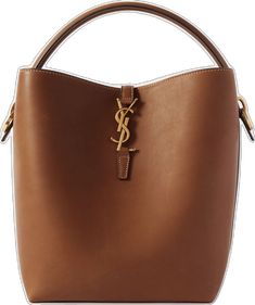 Luxury Tan Bucket Bag With Double Handle, Luxury Tan Double Handle Bucket Bag, Luxury Tan Bucket Bag For Shopping, Designer Tan Bucket Bag, Designer Tan Bucket Bag For Everyday, Designer Brown Bucket Bag For Evening, Designer Bucket Bag With Palladium Hardware, Luxury Tan Crossbody Bucket Bag, Auburn Brown