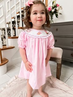 Pink smocked dress with cowgirl embroidery! Perfect for a rodeo birthday party! Clothing Care Instructions: Machine wash gentle. Do not bleach. Tumble dry delicate at low heat. Iron at medium. If the item that you are ordering has red or another bright color in it next to a white or other light color fabric please use a Shout color catcher for the first few washes to avoid bleeding. Follow us on Instagram @thelillieandlilahshop for shop discounts and updates! Rodeo Birthday Outfit, Cowgirl Embroidery, 1st Rodeo Birthday, Rodeo Birthday Party, Cowgirl Dress, 1st Rodeo, Rodeo Birthday Parties, Cowgirl Dresses, Rodeo Birthday