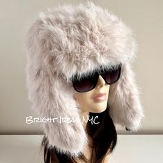 Fun, stylish and warm Cream Faux Fur Trapper Hat that makes the perfect accessory. Snap Clasp closure  Super comfy To view the rest of our collection, please visit: brightideasnyc.com Faux Fur Winter Hat With Ear Flaps, Winter Faux Fur Hats With Ear Flaps, Warm Faux Fur Hats With Ear Flaps, Trendy Winter Hats With Faux Fur Lining, Trendy Faux Fur Winter Hat, Trendy Winter Faux Fur Hat, Adjustable Hats With Faux Fur Trim For Cold Weather, Adjustable Faux Fur Winter Hat, Winter Hats With Faux Fur Trim