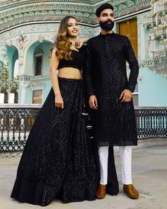 Menswear:- Readymade Faux Georgette Kurta set in Black This Chinese Collar and Full Sleeves attire is Enhanced with Pockets, Resham and Sequins Work Lehenga Choli:-Readymade Faux Georgette Lehenga in Black This attire with Shantoon and Cotton Lining is Enhanced with Fancy Tassels, Resham and Sequins Work Available with a Sleeveless Faux Georgette Black Choli Crafted in Round Neck and a Faux Georgette Dupatta in Black The Choli and Lehenga Lengths are 14 and 42 inches respectively Please refer re Black Sequin Kurta Men, Black Bollywood Style Palazzo Set For Party, Black Bollywood Palazzo Set For Party, Party Wear Lehenga With Dabka Detailing, Eid Reception Party Wear Sets, Black Dabka Lehenga For Wedding, Black Lehenga For Eid Formal Occasion, Black Palazzo Set With Zari Work For Party, Black Palazzo Set For Diwali Party