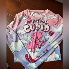 Sugar Thrills Not Today Cupid Tee Nwt Size Medium Very Soft And Stretchy Bin: D4 Tags: Urban Outfitters, Free People, Pacsun, Lululemon, Alo, Cottagecore Pink Y2k Long Sleeve T-shirt, Spring Funny Print Long Sleeve Tops, Cute Printed Pink Top, Cute Pink Printed Tops, Spring Long Sleeve Tops With Funny Print, Blue Long Sleeve Tops With Funny Print, Trendy Pink Printed Tops, Y2k Pink Printed Tops, Pink Y2k Style Printed Tops