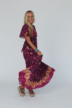 So stunning, you'll add a touch of boho style everywhere you go with our Midnight Floral Maxi Dress - it's a showstopper! Comfortable, lightweight, woven fabric with a bold contrast floral print throughout Relaxed maxi dress silhouette Flattering deep V neckline with short flutter sleeves Smocked back with adjustable self tie belt and side zipper for great fit Lining for added coverage Pair with: Eye Of The Sun Padded Bralette, Turquoise Cascade Necklace and Dazey Springs Buckle Sandal. *Due to Printed Floor-length Maxi Dress For Festivals, Bohemian Printed Maxi Dress, Multicolor Floral Print Maxi Dress For Festival, Floral Print Maxi Dress For Beach, Floral Maxi Dress For Beach, Festival Multicolor Floral Print Maxi Dress, Pink Paisley Print Maxi Dress For Beach, Multicolor Paisley Print Maxi Dress For Vacation, Bohemian Multicolor Floral Print Maxi Dress