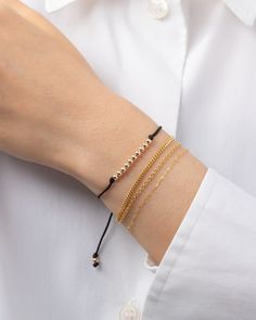 Choose your color, choose your fortune - the 14k gold bead row fortune bracelet is here to bring you good vibes! Each color has its own meaning, so why not mix and match? This cute and versatile bracelet is a must-have for your everyday looks! Adjustable length to fit most wrists: 6.5"- 8" Cord: Nylon Standard Production: 4-7 business days Rush Order Production: 2-5 business days Shipping: Select shipping method at checkout. Shipped from our L.A. Studio. This item is Final Sale. See here for det Red Baby, Personalized Necklace, Gold Beads, Mix And Match, Ring Bracelet, Gold Black, Pink Grey, Everyday Look, Good Vibes