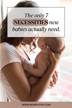 a woman holding a baby in her arms with the words, the only necessities new babies actually need