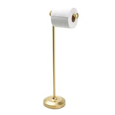 a gold toilet paper holder with a roll of toilet paper on the top of it