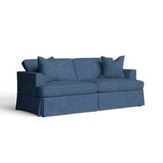 a blue couch sitting on top of a white floor