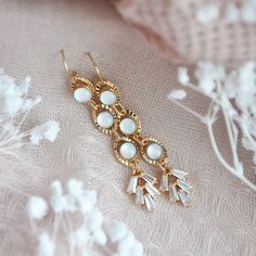 "Boho Wedding Earrings // Bridal Statement Earrings // 14k Gold Filled Earrings Gorgeous glowing opalite stones and dainty cubic zirconia fans secured to delicate 14k gold filled earring wires. These long and beautiful statement earrings are the perfect accessory for your special day or your bridesmaids. All of my jewelry arrives suitably gift wrapped ready for gift giving. For hygienic reasons I don't accept returns or exchanges on earrings. Measurements: The bridal statement earrings hang appr Wedding Ideas Bohemian, Free Spirit Wedding, Boho Bridal Earrings, Wedding Jewelry Crystal, Boho Bridal Jewelry, Boho Wedding Earrings, Opalite Necklace, Bridal Statement Earrings, Gold Bridal Necklace