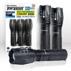 three flashlights are sitting next to each other in front of a package for the camera