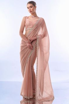 Elevate your festive wardrobe with this exquisite Designer Saree. Crafted from premium fancy fabric, this saree features intricate designer work lace border that beautifully complements the luxurious Art Silk blouse. The highlight of this ensemble is the stunning Swarovski work that adds a touch of opulence and sparkle, making it perfect for any festive occasion. Whether it's a grand celebration or an intimate gathering, this saree promises to make you shine with its elegant and sophisticated de Silk Saree New Collection, Saree Laces And Borders, Sarees For Festival, Shapewear For Saree, Plain Saree With Lace Border, Farewell Saree Blouse Designs, Pestal Colour Sarees, Peach Blouse Design, Blouse Design For Farewell