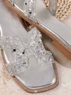 Sparkling Silver Stride: Chic Flat Sandals for Women Chic Sparkling Sandals For Summer, Trendy Silver Sandals For Party, Chic Sparkling Sandals For Spring, Glamorous Synthetic Sandals For Spring, Silver Sandals For Summer Party, Silver Summer Party Sandals, Chic Sparkling Synthetic Sandals, Glamorous Sparkling Synthetic Sandals, Summer Synthetic Sandals With Shimmer