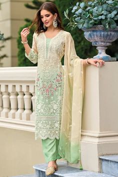 This exquisitely designed soft organza pant style suit Pakistani Suit is embellished with delicate resham thread work, beads, sequins, and lace work, making it a standout piece for any occasion. From festive celebrations to social gatherings and cultural events, this pant suit showcases the ultimate combination of style and grace.     Fit:  Slim Fit (more fitted and snug at bust area)    Top: Soft Organza Silk  Bottom: Blended Silk  Dupatta: Embroidered Organza Silk   Resham thread work, beads, Lucknowi Kurta, Chikankari Suits, Pakistani Suits Online, Bridal Dupatta, Kurta Dress, Silk Bottoms, Pantsuits For Women, Party Wear Lehenga, Pakistani Suits