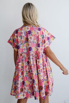 A look like the Lovely Muse Pink Floral Babydoll Mini Dress will have everyone who sees you swooning! Crafted from lightweight fabric, this dress combines comfort with effortless style, making it perfect for sunny days and casual outings. This floral motif adds a fresh and cheerful touch, enhancing the dress's overall appeal and creating a captivating visual contrast against the pink backdrop. Designed in a babydoll silhouette, the dress offers a relaxed fit with a gathered empire waistline that Playful Pink V-neck Dress, Playful Smocked Summer Dresses, Playful Pink Dresses For Loungewear, Playful Summer Smock Dress, Playful Short Sleeve Dresses For Brunch, Cotton Floral Print Loungewear Dresses, Cotton Smock Mini Dress For Daywear, Cute Smocked Short Sleeve Dresses, Floral Print Short Sleeve Sundress For Daywear