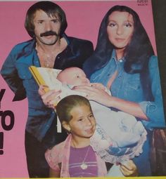 a magazine with a man and woman holding a baby