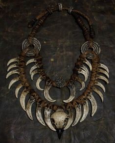 Crafted for the daring and unique, this neck jewelry embodies a fusion of Bohemian style and post-apocalyptic vibes. Perfect for shaman costumes, LARP products, and festival decorations, it features fangs and bird skulls for an edgy touch. This double necklace adorned with a ring necklace is a must-have for horror lovers looking to make a bold statement with their accessories. A distinctive piece that sets you apart from the crowd. ❗️DETALIS❗️ Our products are meticulously crafted by skilled art Handmade Gothic Horned Jewelry, Viking Style Handmade Festival Jewelry, Unique Handmade Jewelry For Alternative Fashion, Bohemian Skull-shaped Metal Jewelry, Handmade Bohemian Jewelry For Alternative Fashion, Shaman Costume, Demon Costume, Neck Jewelry, Horror Lovers