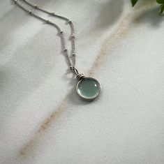 "Sterling Silver Rain Drop Necklace, Aesthetic Necklace Cottagecore Jewelry, Bohemian Necklace for Women Nature Jewelry Gift for Her Our Spring Rain Drop Necklace is made with sterling silver. The silver brightens this beautifully simple design. This Earthy Necklace is the perfect gift for a nature lover. They will love this simple Aesthetic Necklace and bright sterling glass pendant with a beautiful cottagecore jewelry. Handmade Art Glass Jewelry by Weathered Heather in Central NY! The dainty n Bohemian Round Necklace For Everyday, Bohemian Round Necklace For Everyday Wear, Everyday Bohemian Round Necklace, Bohemian Everyday Round Necklace, Bohemian Charm Necklaces With Clavicle Chain, Bohemian Clavicle Chain Charm Necklace, Bohemian Everyday Clavicle Chain Jewelry, Bohemian Clavicle Chain Jewelry For Everyday, Everyday Wire Wrapped Round Necklaces