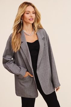 This blazer redefines elegance with its oversized silhouette that effortlessly bridges comfort and style. The welt pocket on the right front adds a touch of functionality and charm. The long sleeves offer versatility for various occasions, making it suitable for both formal and casual settings. With a clean and minimalistic design, the one-button closure provides a polished finish that complements the overall aesthetic. - Model is 5' 9" 33-24-34 and wearing a size Small Style: Casual Print / Pat Spring Oversized Blazer With Welt Pockets, Solid Blazer With Pockets For Office Wear, Oversized Solid Blazer With Notch Lapel, Chic Oversized Blazer With Suit Collar, Oversized Office Blazer With Pockets, Oversized Office Blazer With Welt Pockets, Trendy Oversized Blazer With Pockets, Oversized Single Button Chic Blazer, Oversized Single Breasted Blazer For Office